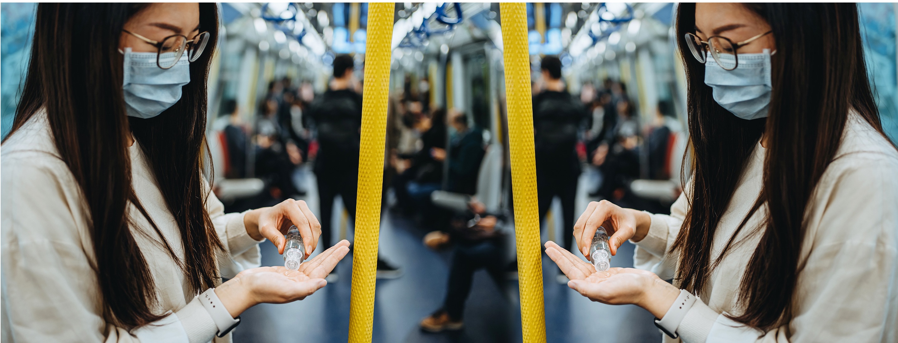 Asian woman riding public transportation while using hand sanitizer